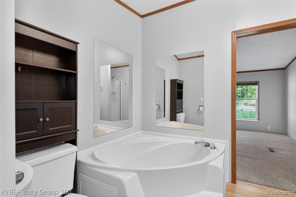 672 Red Oaks Drive, Howell, MI 48843 — Photo 17