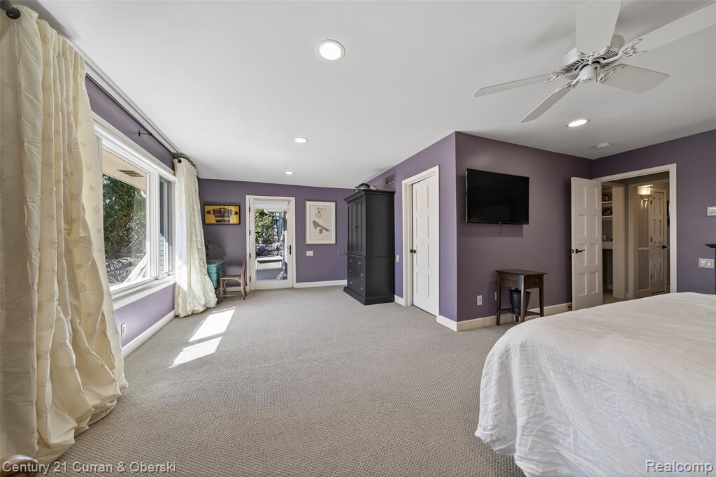 Bedroom featuring access to exterior, light colored carpet, a ceiling fan, and recessed lighting