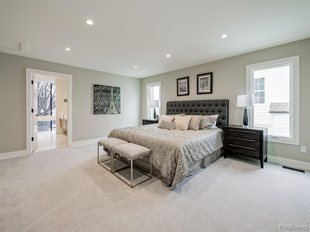 Bedroom featuring light carpet and recessed lighting