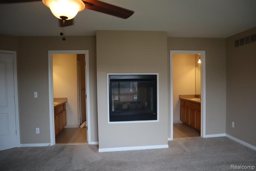 Half bath featuring light tile patterned floors and vanity