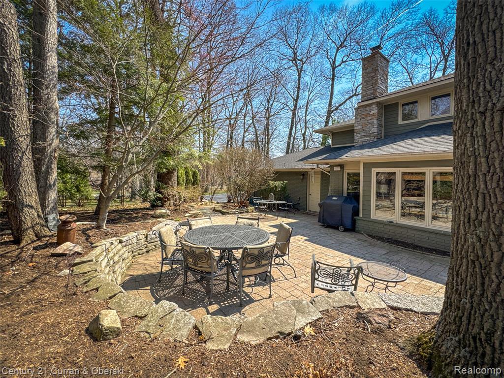 View of patio featuring outdoor dining space and area for grilling