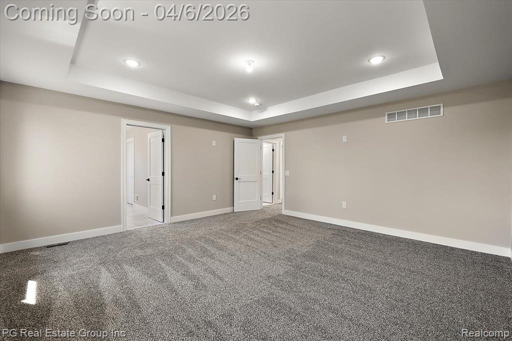 Basement featuring carpet and recessed lighting