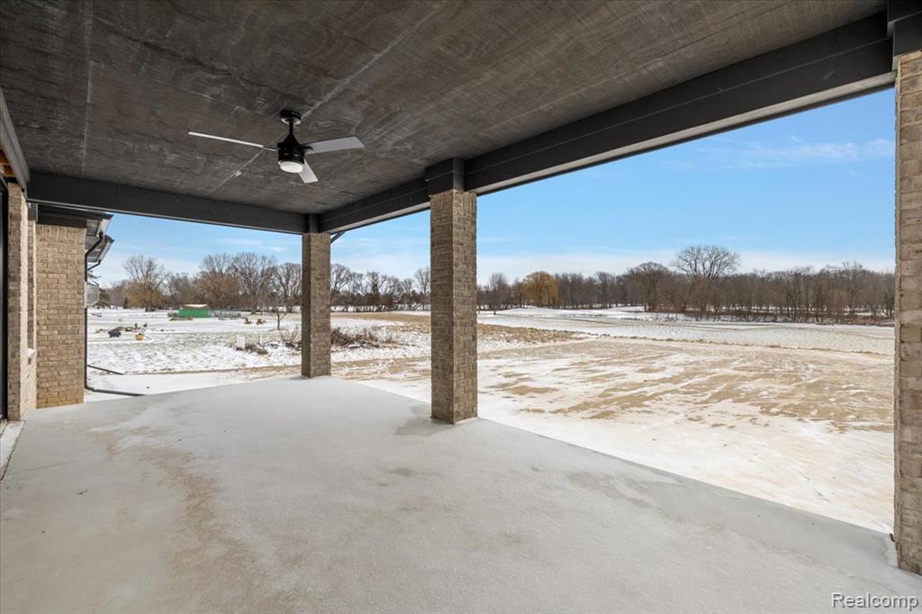 Large covered patio with ceiling fan