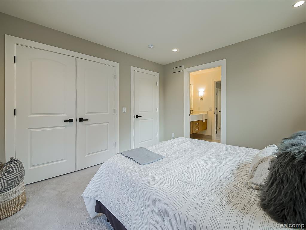 Carpeted bedroom featuring recessed lighting, a closet, and connected bathroom