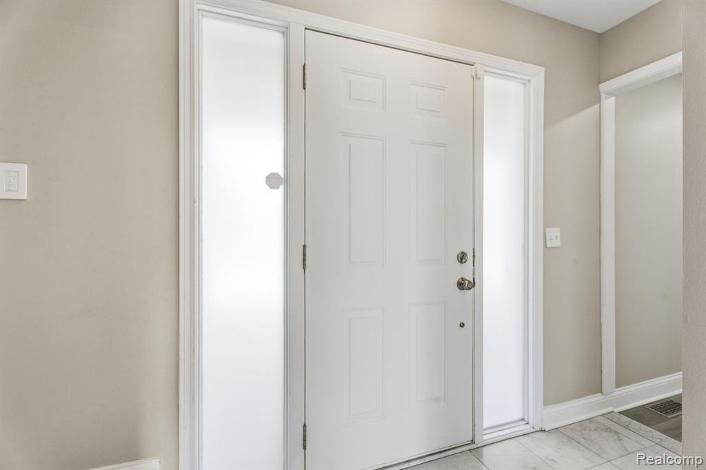 Entrance foyer with baseboards