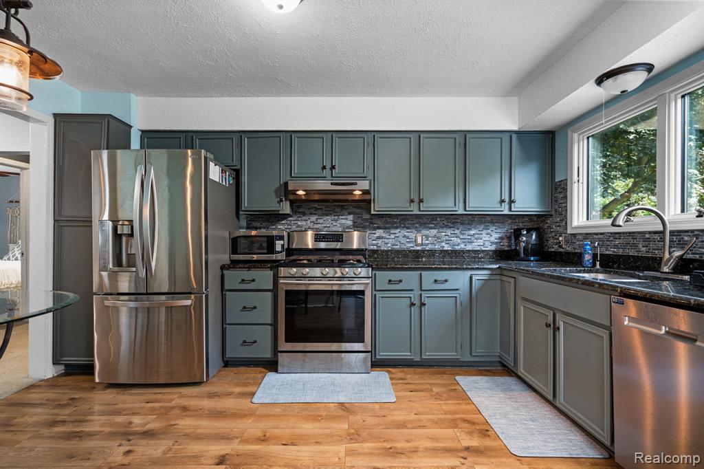 971 Tierney, Highland, MI 48356 — Photo 18