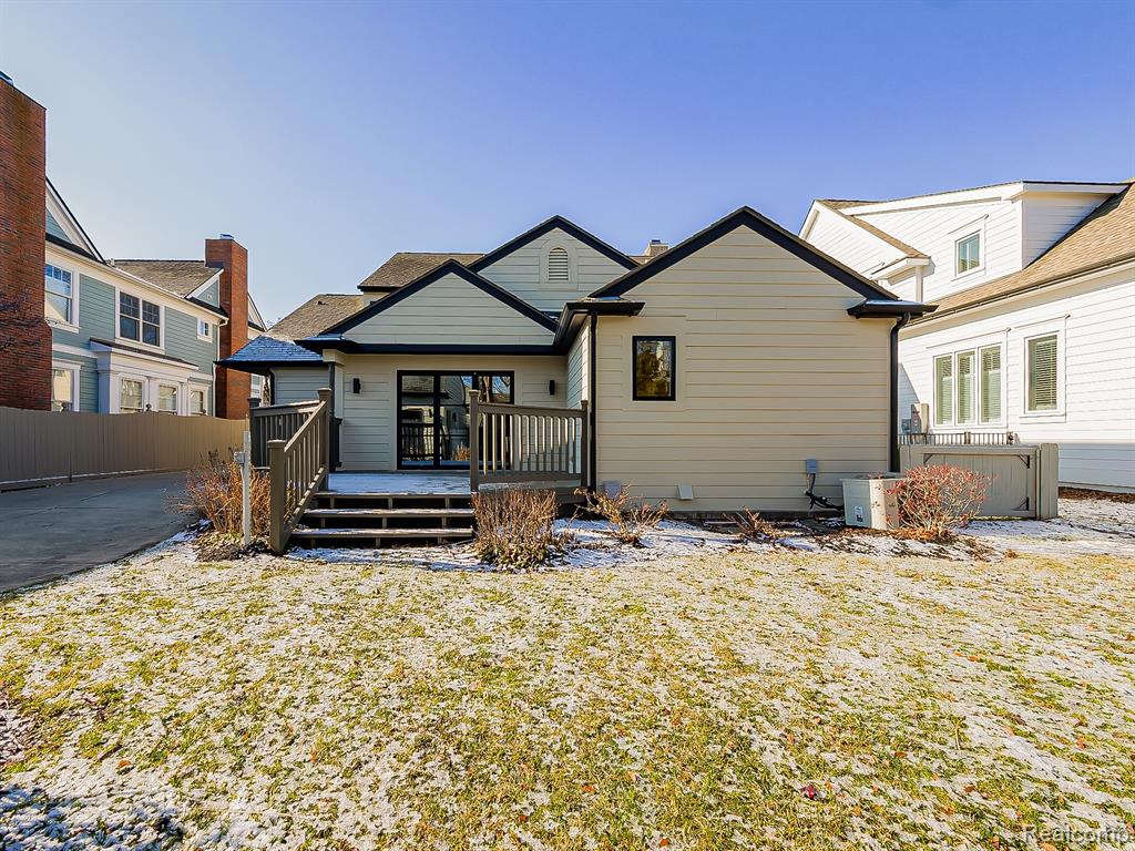Rear view of property with a deck