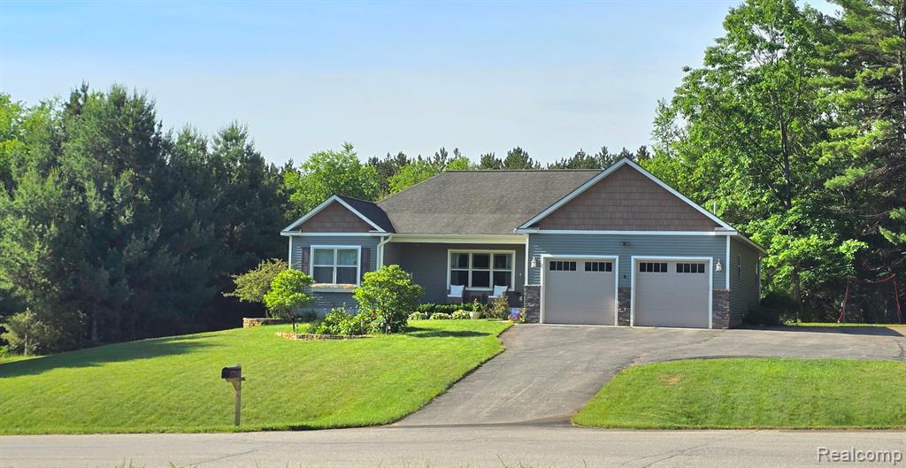 9865 Loons Call Drive, Traverse City, MI 49685 — front exterior