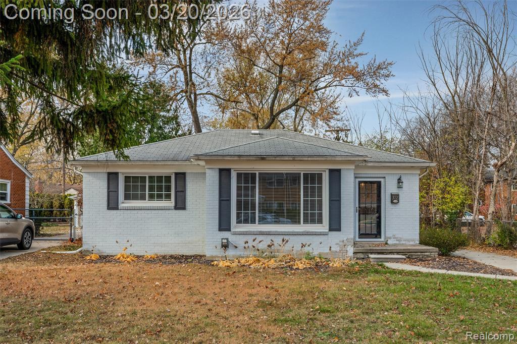 View of front of property featuring brick siding