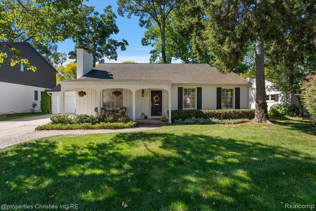 White exterior with black shutters and a covered porch