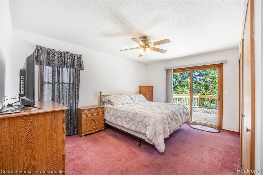 Primary Bedroom with Lake Views and access to huge deck!