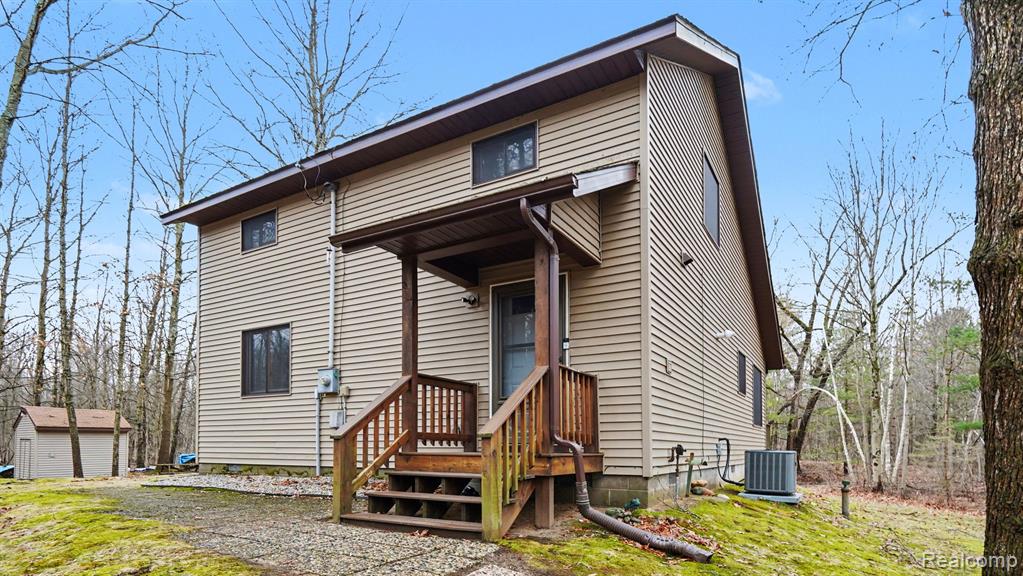 301 W Fike Road, Sanford, MI 48657 — front exterior