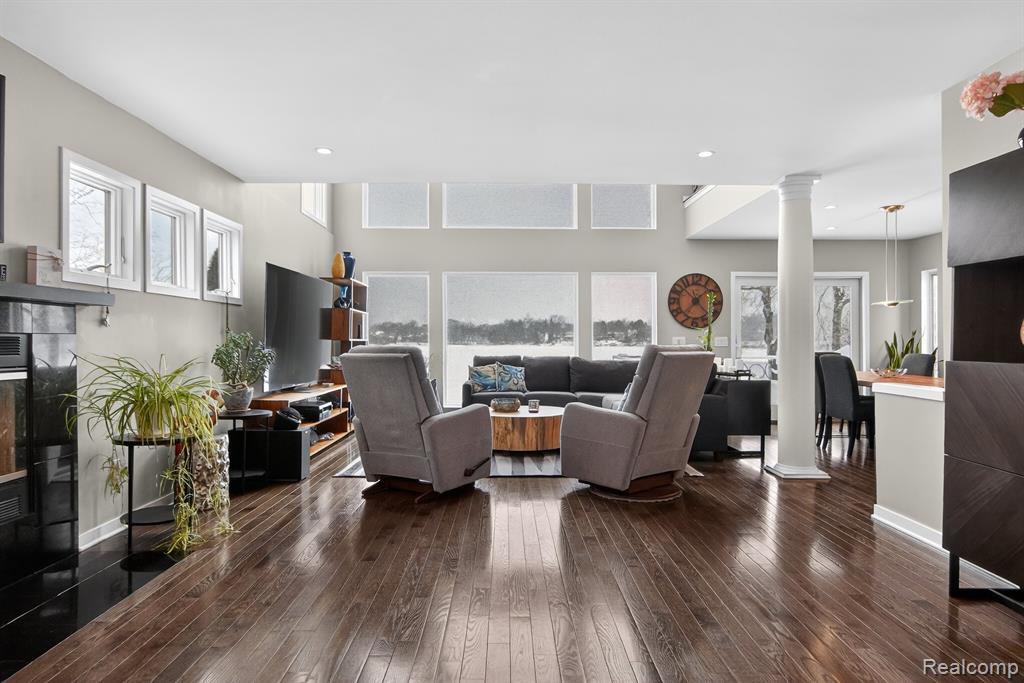 Detailed view of a fireplace and wood finished floors