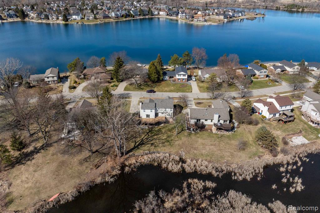 Aerial view of residential area with a large body of water