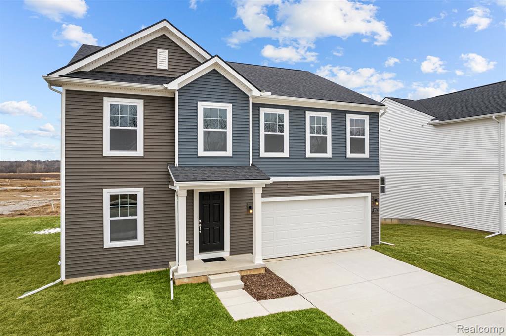 627 Countryside Drive, Chelsea, MI 48118 — front exterior
