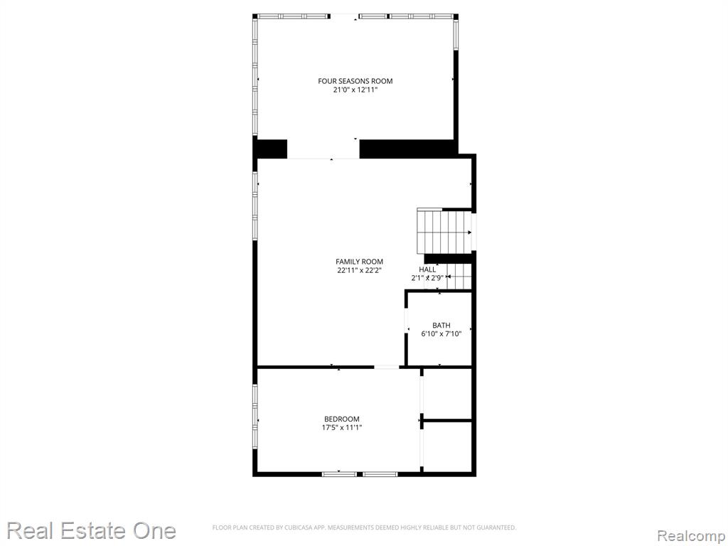 The lower level includes a large family room and an incredible four seasons room