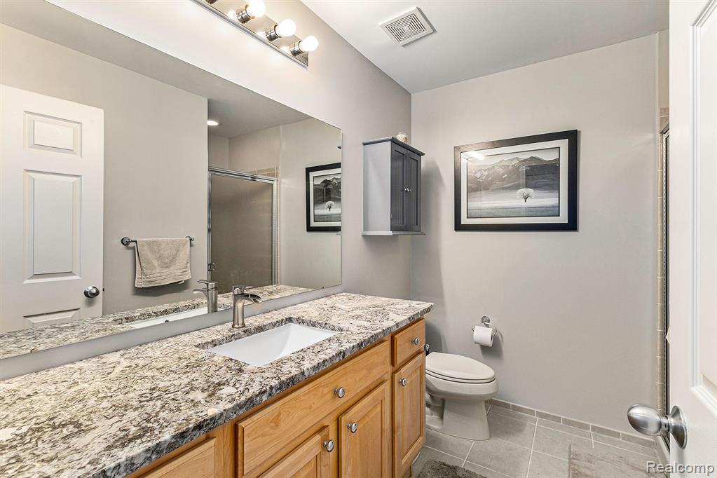 648 WOODHAVEN Drive, Commerce Twp, MI 48390 — Photo 17