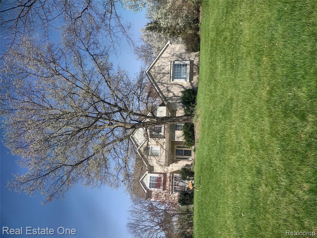 743 Aaron Drive, Highland, MI — front exterior