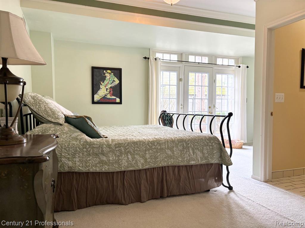 Bedroom with carpet flooring, access to outside, and french doors