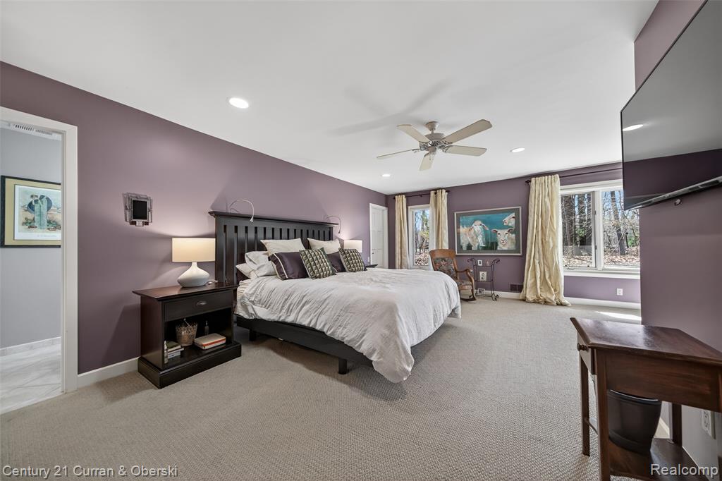 Bedroom featuring carpet flooring, ceiling fan, and recessed lighting