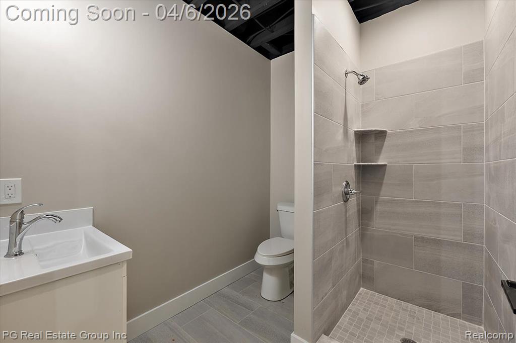 Full bath featuring vanity and a stall shower