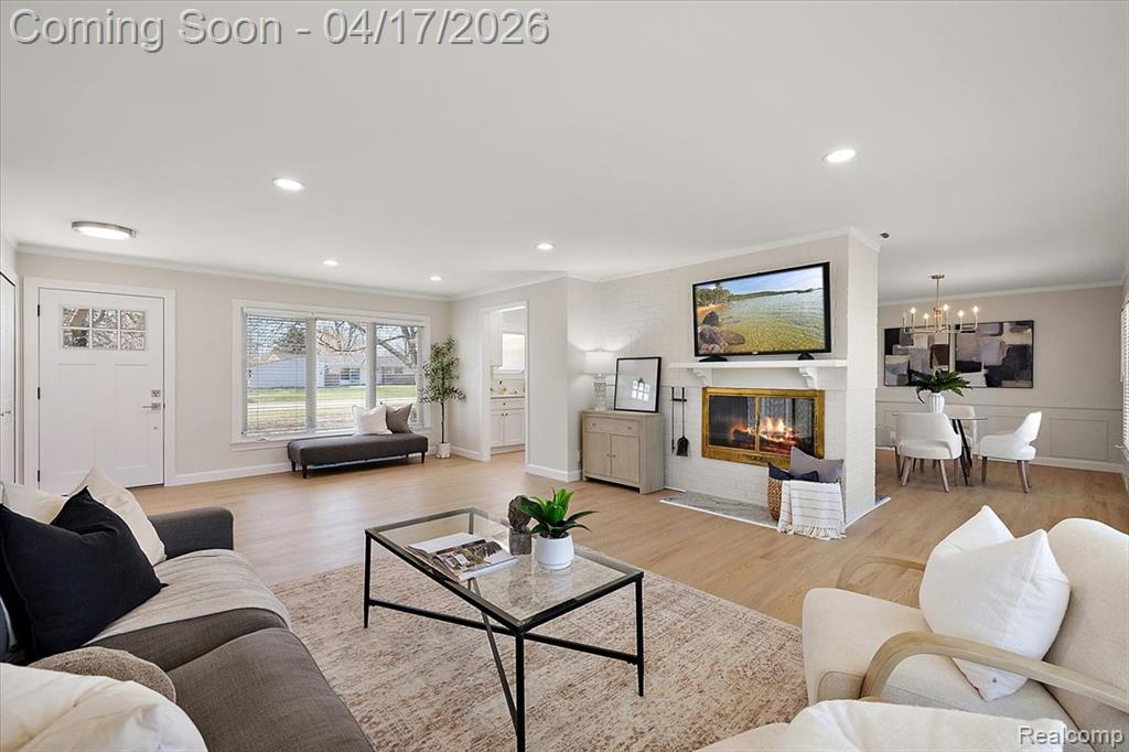 View of Great Room w/Double Sided Fireplace, Fully Renovated Kitchen & Formal Dining Room