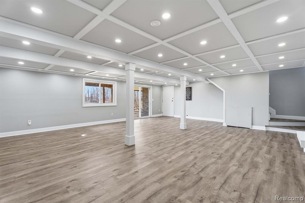 Below grade area with recessed lighting and light wood finished floors
