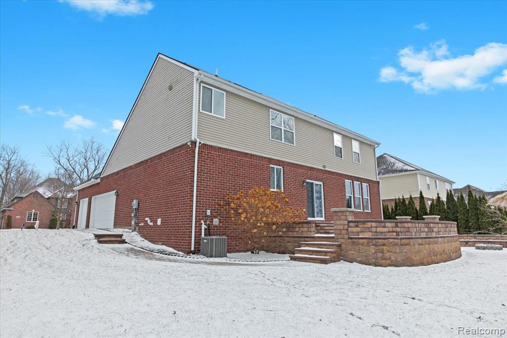 Snowy aerial view with a residential view