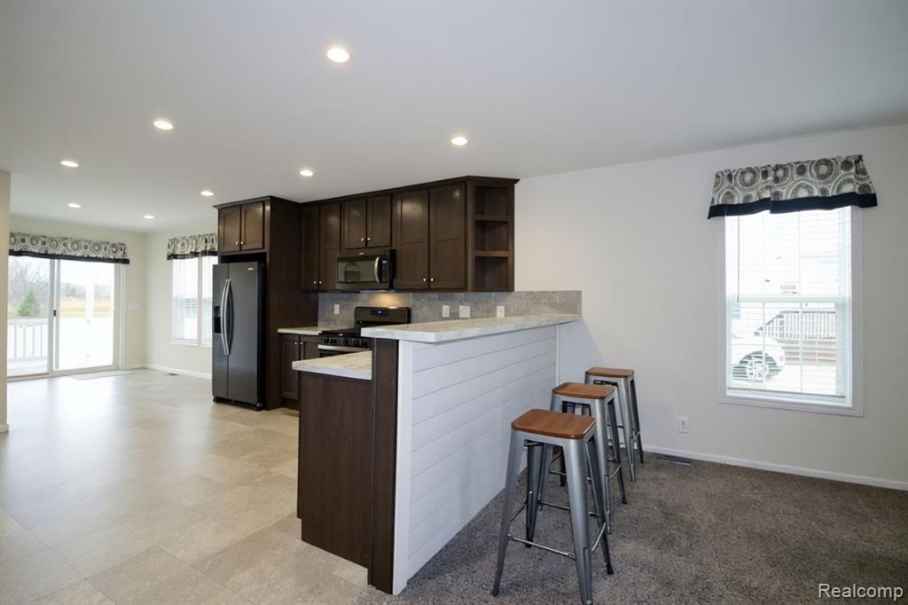 8447 S Brookston Drive, Willis, MI 48191 — Photo 13