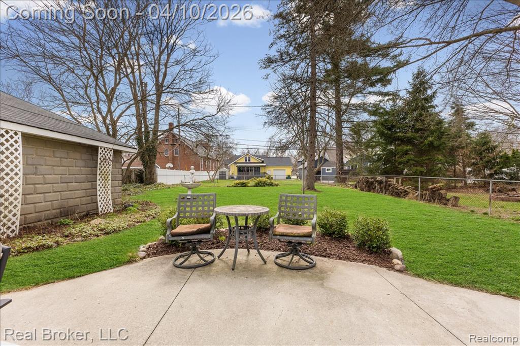 Fenced backyard featuring a patio
