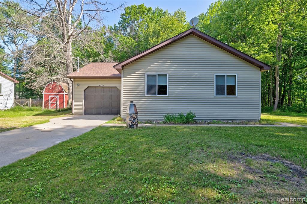 6250 Woodland Drive, Lake, MI 48632 — front exterior