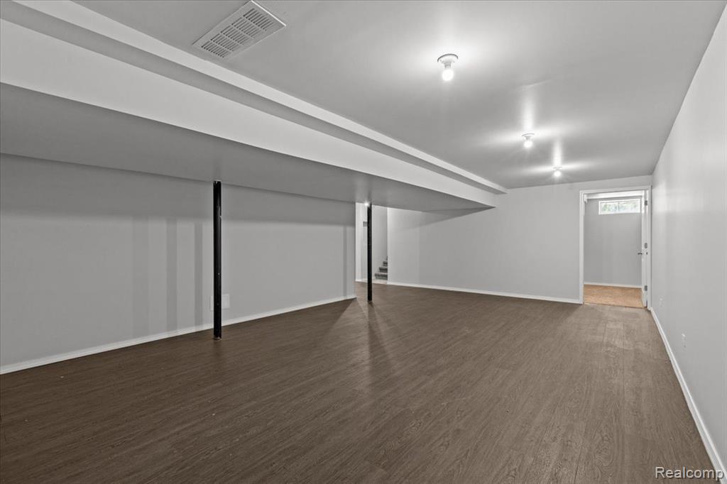 Traditional-style house with brick siding