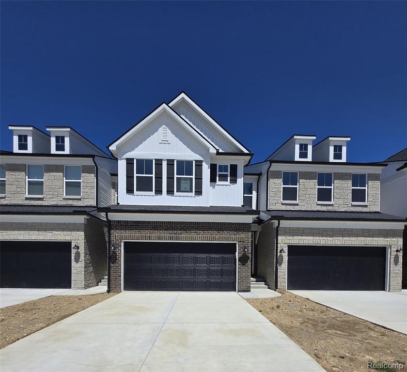 5557 E Spaniel Drive, Ann Arbor, MI 48108 — front exterior