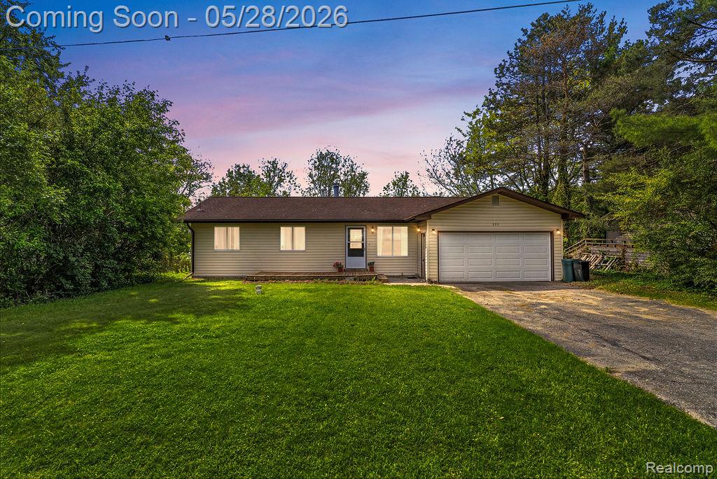 233 Peninsula Lake Drive, Highland, MI — front exterior