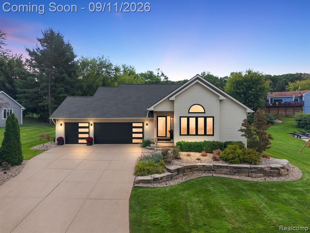 Contemporary ranch-style exterior with light-colored siding