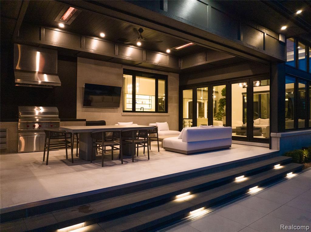View of patio / terrace with an outdoor kitchen, outdoor dining area, and outdoor lounge area