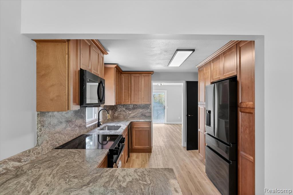 677 Lucille Drive, Wolverine Lake, MI 48390 — Photo 12