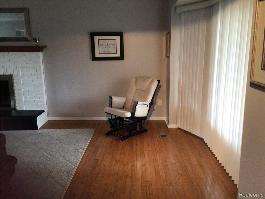 Living area featuring hardwood / wood-style floors and a fireplace
