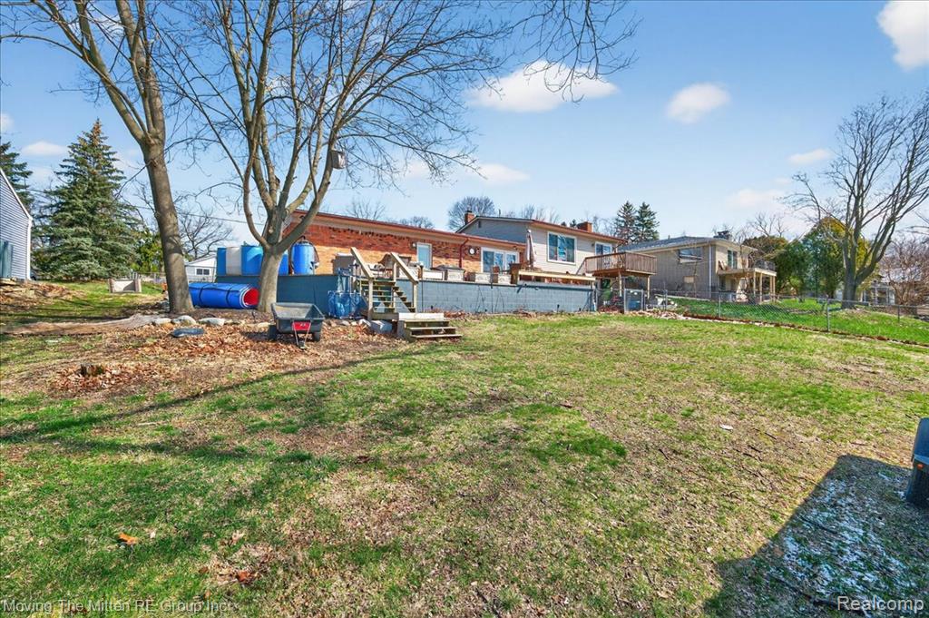 View of yard with a wooden deck