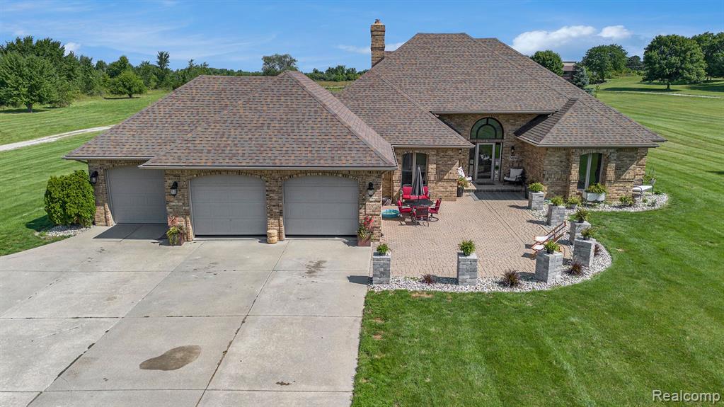 7404 CALKINS Road, Flint, MI 48532 — front exterior