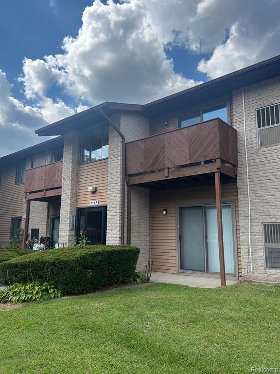 7547 MANOR Circle, 201, Westland, MI — front exterior