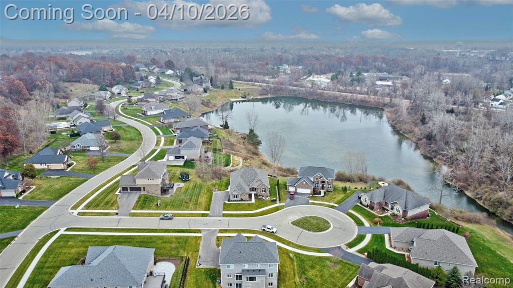 Aerial perspective of suburban area with a large body of water