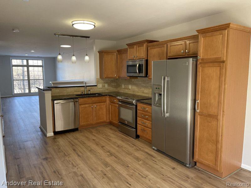 650 VILLAGE Lane, Milford, MI 48381 — Photo 11