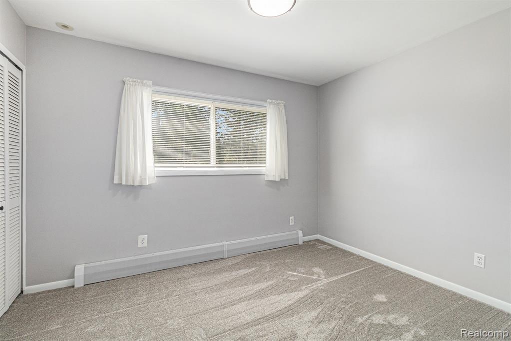 2145 Helmsford Drive, Wolverine Lake, MI 48390 — Photo 33