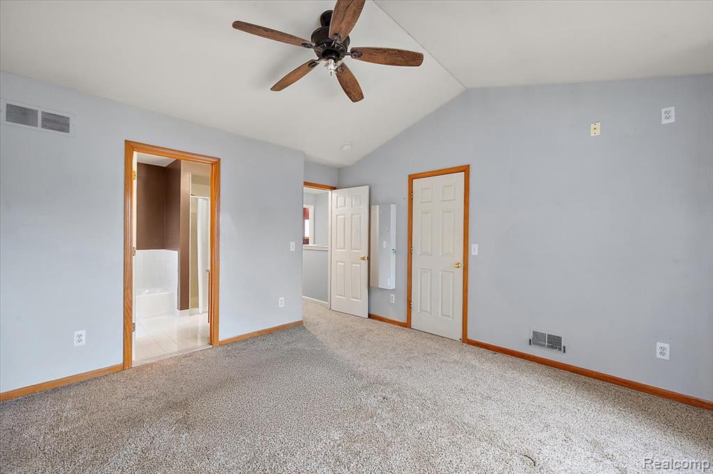 Primary Bedroom with Ensuite Bathroom and Walk-in Closet