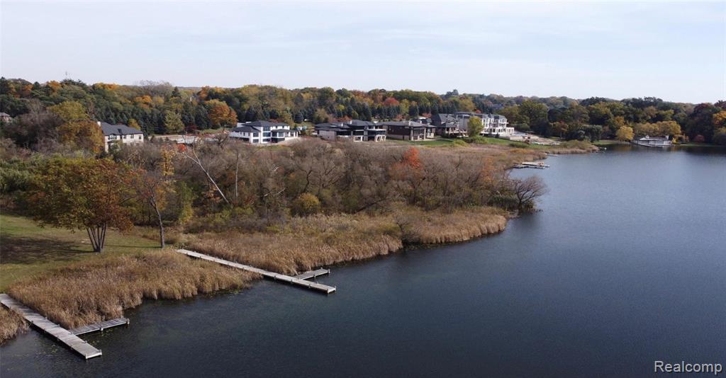 Bird's eye view of a large body of water and a heavily wooded area
