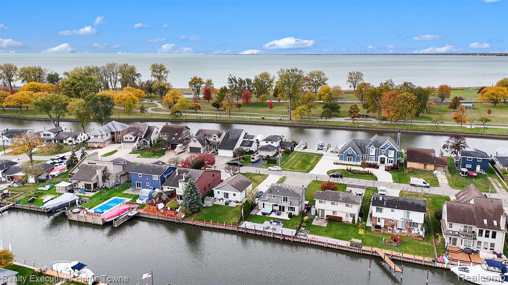 Aerial view of residential area with a large body of water