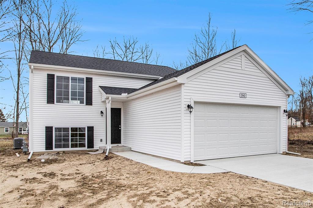 8068 Moonlight Creek Lane, Fowlerville, MI 48836 — front exterior
