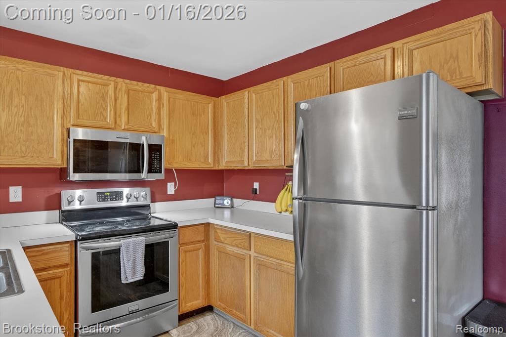 875 Adelaide Drive, Wolverine Lake, MI 48390 — Photo 16