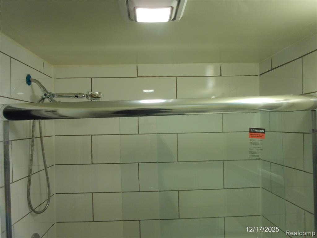 Bathroom view of a tile shower